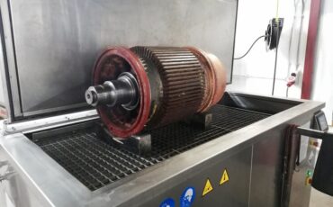 Ultrasonic cleaning of electric motor